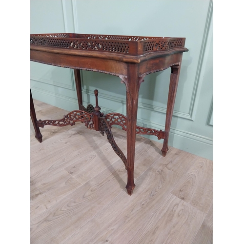 298 - Georgian mahogany tea table in the Chippendale style with pierced gallery raised on four tapered leg... 