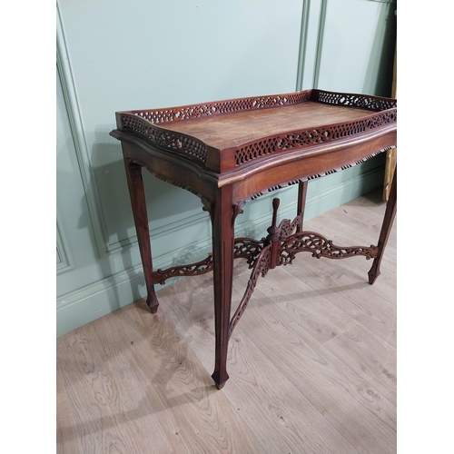 298 - Georgian mahogany tea table in the Chippendale style with pierced gallery raised on four tapered leg... 