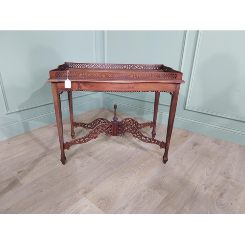 298 - Georgian mahogany tea table in the Chippendale style with pierced gallery raised on four tapered leg... 