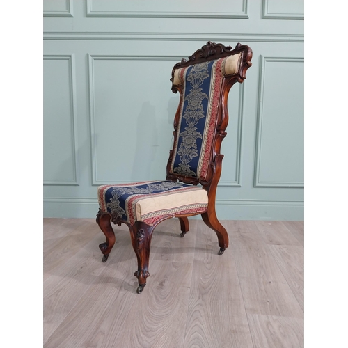 309 - William IV carved walnut and upholstered nursing chair raised on cabriole legs and brass castors {20... 