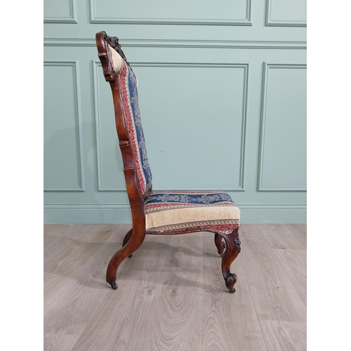 309 - William IV carved walnut and upholstered nursing chair raised on cabriole legs and brass castors {20... 