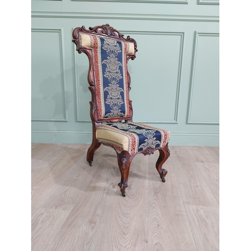 309 - William IV carved walnut and upholstered nursing chair raised on cabriole legs and brass castors {20... 