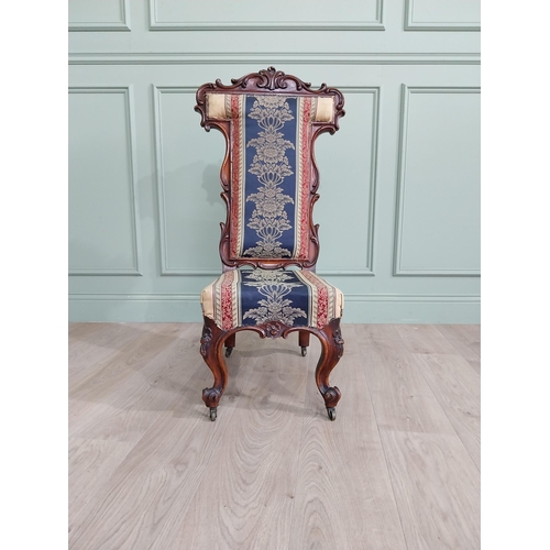 309 - William IV carved walnut and upholstered nursing chair raised on cabriole legs and brass castors {20... 