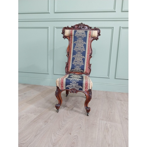 309 - William IV carved walnut and upholstered nursing chair raised on cabriole legs and brass castors {20... 