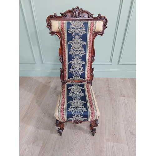 309 - William IV carved walnut and upholstered nursing chair raised on cabriole legs and brass castors {20... 