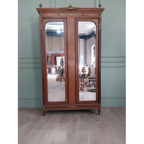 319 - 19th C. French kingwood wardrobe with two mirrored doors and ormolu mounts raised on turned feet {23... 