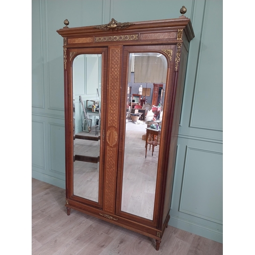 319 - 19th C. French kingwood wardrobe with two mirrored doors and ormolu mounts raised on turned feet {23... 