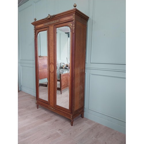 319 - 19th C. French kingwood wardrobe with two mirrored doors and ormolu mounts raised on turned feet {23... 