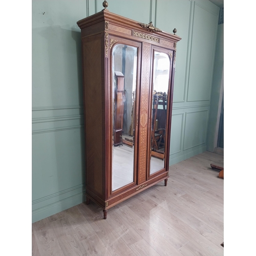 319 - 19th C. French kingwood wardrobe with two mirrored doors and ormolu mounts raised on turned feet {23... 