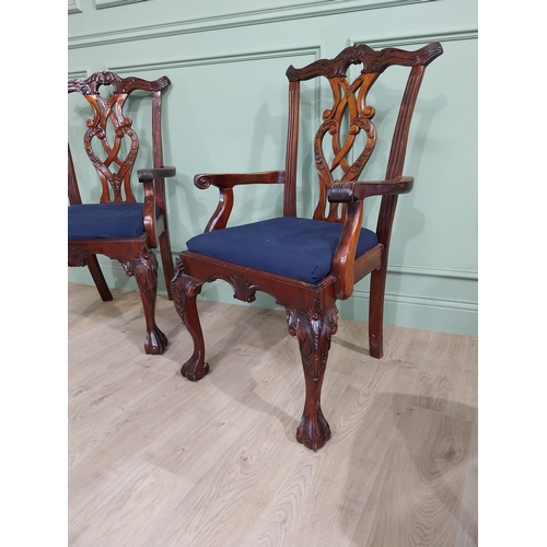 323 - Pair of carved mahogany open armchairs with upholstered seats raised on cabriole legs in the Chippen... 