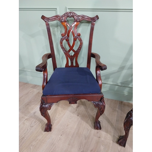 323 - Pair of carved mahogany open armchairs with upholstered seats raised on cabriole legs in the Chippen... 