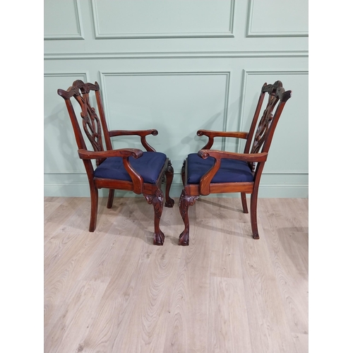 323 - Pair of carved mahogany open armchairs with upholstered seats raised on cabriole legs in the Chippen... 