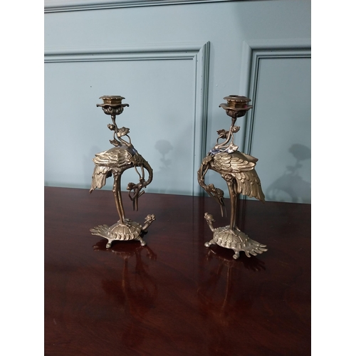 345 - Pair of Oriental brass candlesticks in the form of Cranes mounted on Tortoises {27 cm H x 14 cm W x ... 