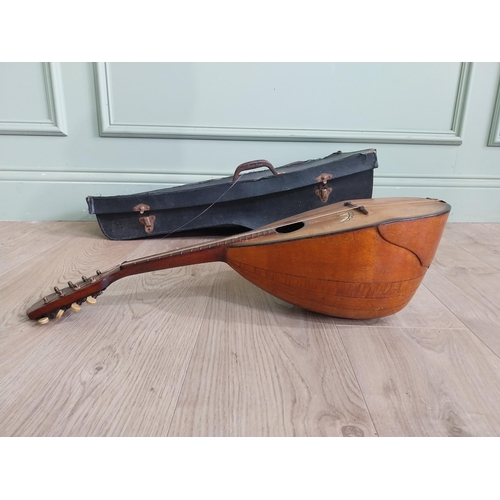 369 - Mandolin in leather case.