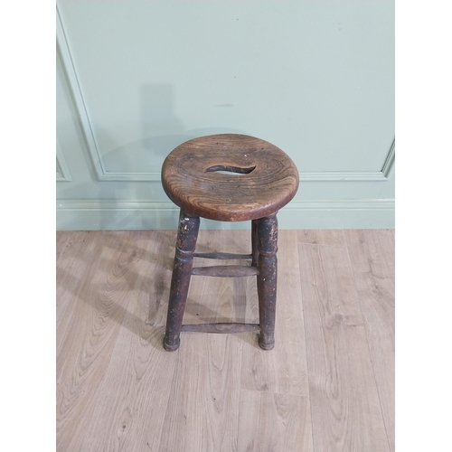 37 - Early 20th C. oak and elm stool raised on turned legs and four stretchers {55 cm H x 33 cm W x 33 cm... 