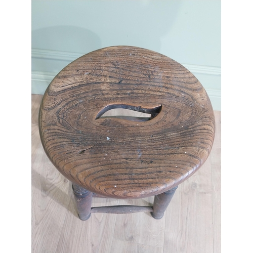 37 - Early 20th C. oak and elm stool raised on turned legs and four stretchers {55 cm H x 33 cm W x 33 cm... 