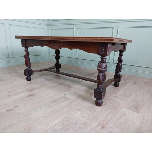 388 - Edwardian oak drawer leaf dining table raised on carved legs and single stretcher {78 cm H x 106 cm ... 