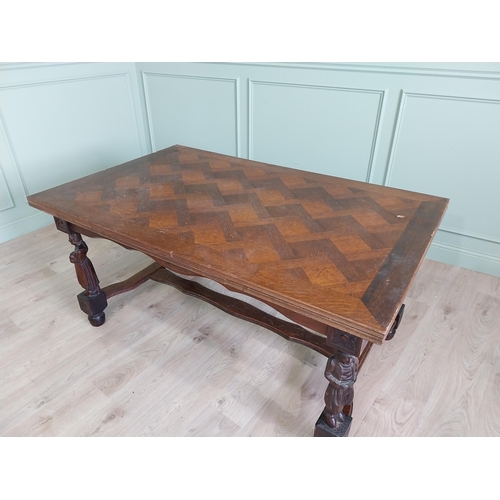 388 - Edwardian oak drawer leaf dining table raised on carved legs and single stretcher {78 cm H x 106 cm ... 