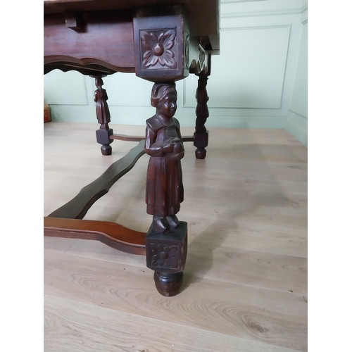 388 - Edwardian oak drawer leaf dining table raised on carved legs and single stretcher {78 cm H x 106 cm ... 