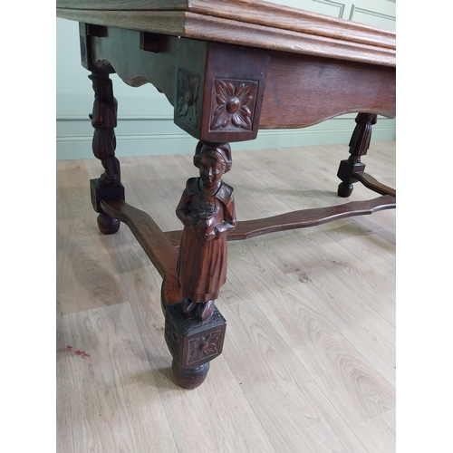 388 - Edwardian oak drawer leaf dining table raised on carved legs and single stretcher {78 cm H x 106 cm ... 