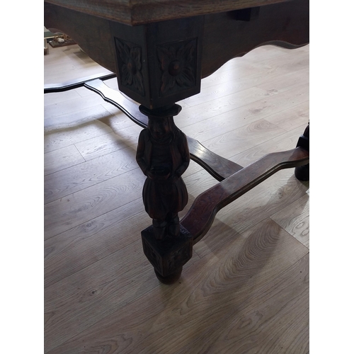 388 - Edwardian oak drawer leaf dining table raised on carved legs and single stretcher {78 cm H x 106 cm ... 