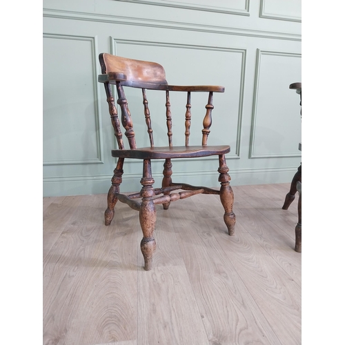 395 - Two 19th C. ash and elm smoker bow chairs raised on turned legs and two stretchers {88 cm H x 64 cm ... 