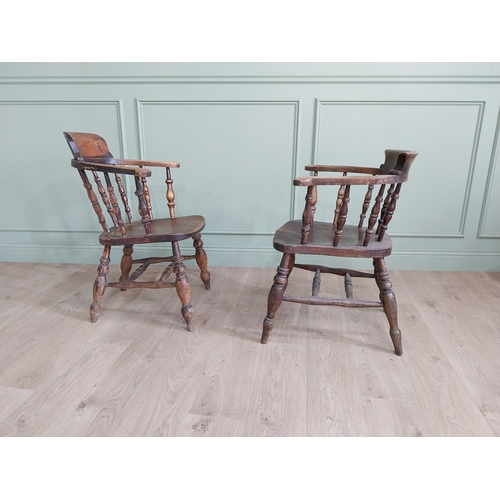 395 - Two 19th C. ash and elm smoker bow chairs raised on turned legs and two stretchers {88 cm H x 64 cm ... 