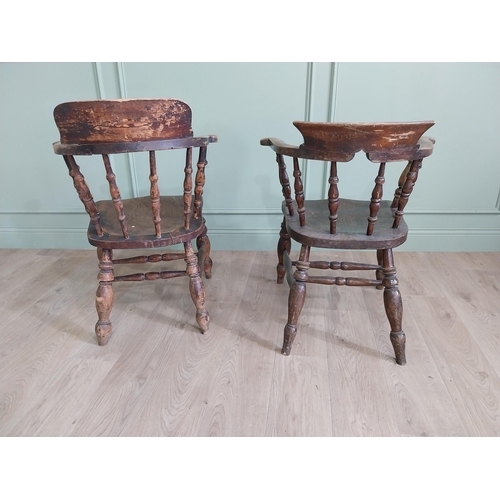 395 - Two 19th C. ash and elm smoker bow chairs raised on turned legs and two stretchers {88 cm H x 64 cm ... 