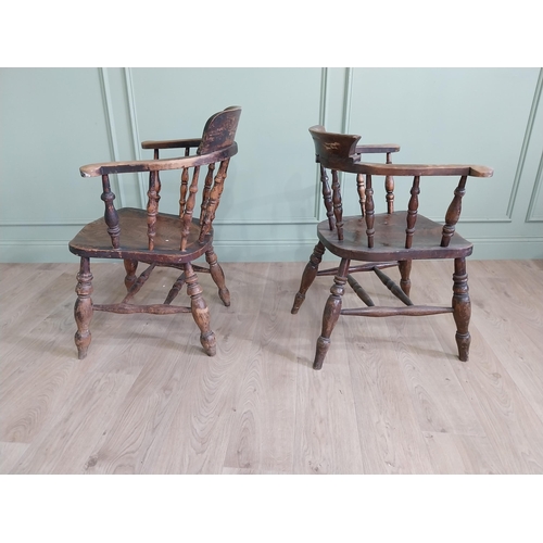 395 - Two 19th C. ash and elm smoker bow chairs raised on turned legs and two stretchers {88 cm H x 64 cm ... 