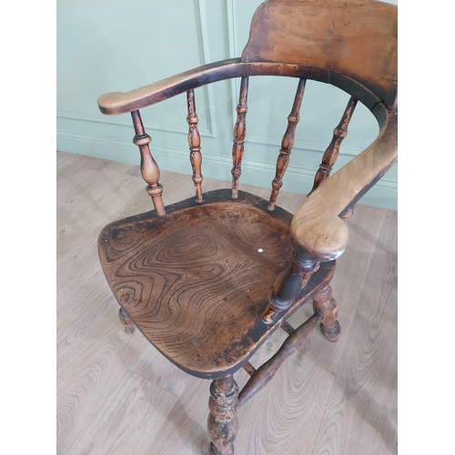 395 - Two 19th C. ash and elm smoker bow chairs raised on turned legs and two stretchers {88 cm H x 64 cm ... 