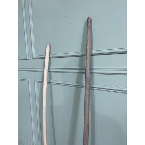 402 - Two antique wooden hay forks {160 cm H x 34 cm W and 146 cm H x 30 cm W}.