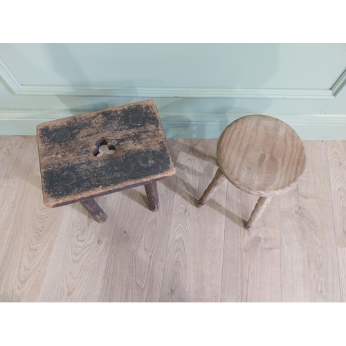 425 - Two early 20th C. pine milking stools {33 cm H x 30 cm W x 23 cm D and 33 cm H x 22 cm W x 22 cm D}.