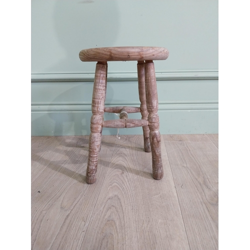 425 - Two early 20th C. pine milking stools {33 cm H x 30 cm W x 23 cm D and 33 cm H x 22 cm W x 22 cm D}.