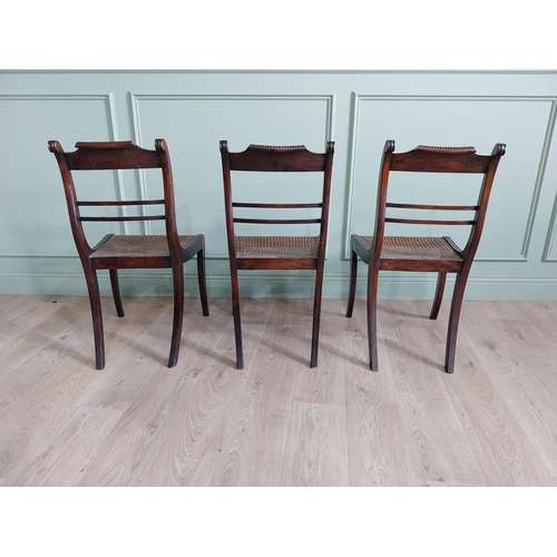 432 - Set of three Regency rosewood and brass inlaid chairs with rattan seats {88 cm H x 47 cm W x 55 cm D... 