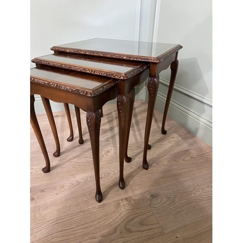 44 - Good quality mahogany nest of three tables with inset glass tops raised on cabriole legs {55 cm H x ... 