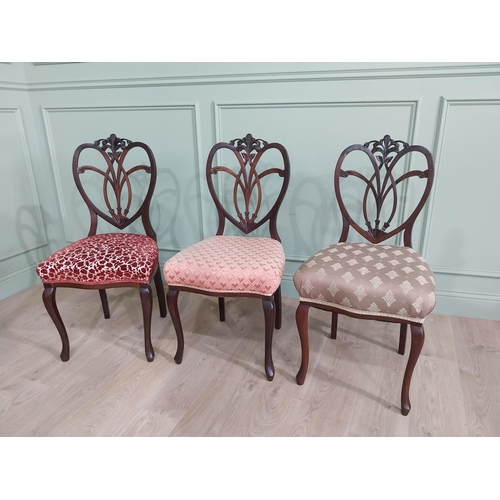 444 - Set of three Edwardian mahogany shield back side chairs with upholstered seat raised on cabriole leg... 