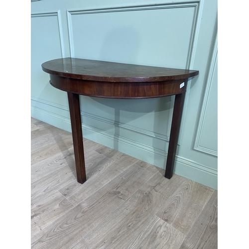 453 - Georgian mahogany demi-lune side table raised on square legs {73 cm H x 107 cm W x 52 cm D}.