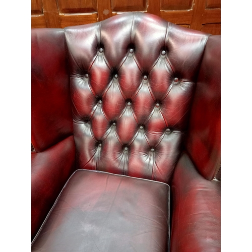 466 - Deep buttoned leather wingback fireside chair raised on Queen Ann legs {H 112cm x W 90cm x D 90cm } ... 