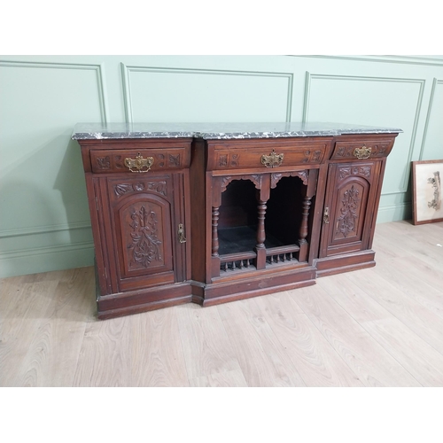 467 - Edwardian carved mahogany side cabinet with marble top and three short drawers above two blind doors... 