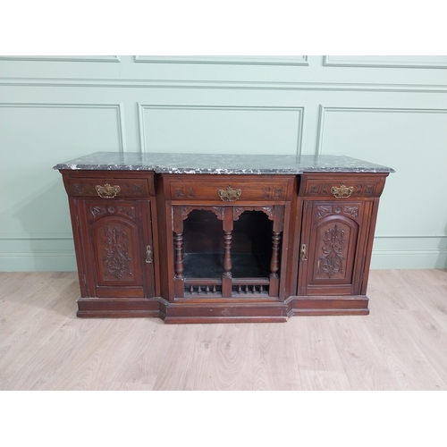 467 - Edwardian carved mahogany side cabinet with marble top and three short drawers above two blind doors... 