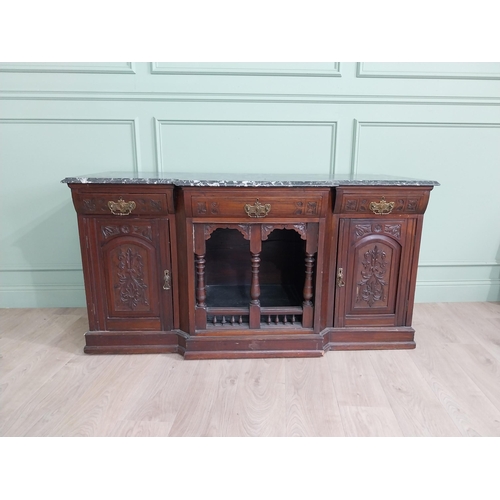 467 - Edwardian carved mahogany side cabinet with marble top and three short drawers above two blind doors... 