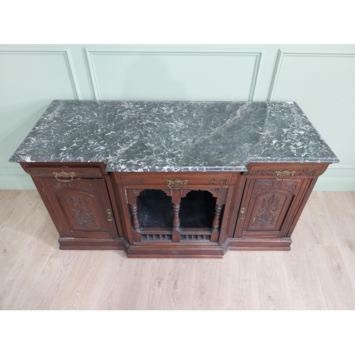 467 - Edwardian carved mahogany side cabinet with marble top and three short drawers above two blind doors... 