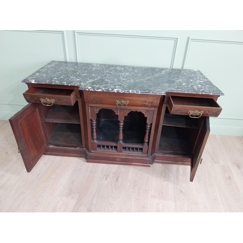 467 - Edwardian carved mahogany side cabinet with marble top and three short drawers above two blind doors... 