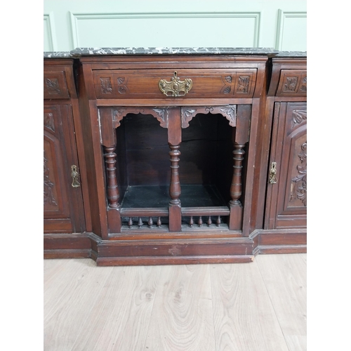 467 - Edwardian carved mahogany side cabinet with marble top and three short drawers above two blind doors... 