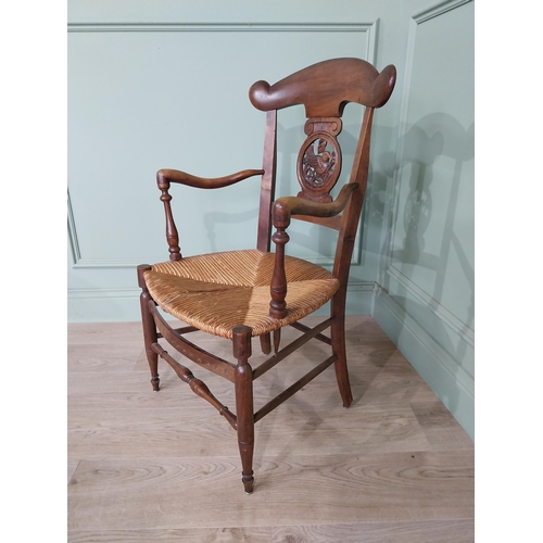 471 - Edwardian carved walnut open armchair with rushed upholstered seat raised on turned legs {92 cm H x ... 