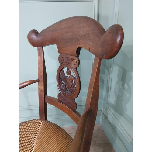 471 - Edwardian carved walnut open armchair with rushed upholstered seat raised on turned legs {92 cm H x ... 