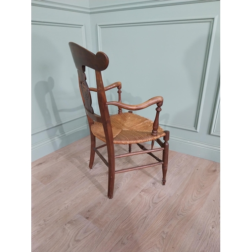 471 - Edwardian carved walnut open armchair with rushed upholstered seat raised on turned legs {92 cm H x ... 