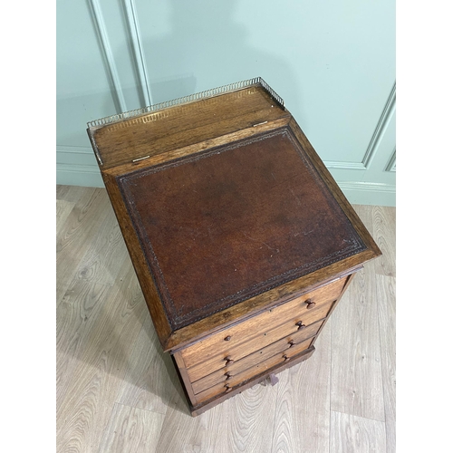 477 - 19th C. rosewood Davenport with brass gallery back, inset leather top, fitted interior and four draw... 