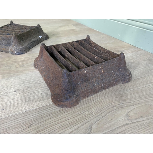 507 - Pair of Victorian cast iron foot scrapers {10 cm H x 32 cm W x 32 cm D}.