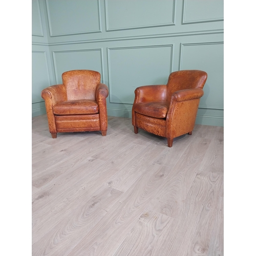 Pair of his and hers French hand dyed leather upholstered tub chairs raised on square tapered legs {75 cm H x 70 cm W x 77 cm D AND 77 cm H x 76 cm W x 81 cm D}.